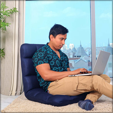 Reclining floor seat with cushion