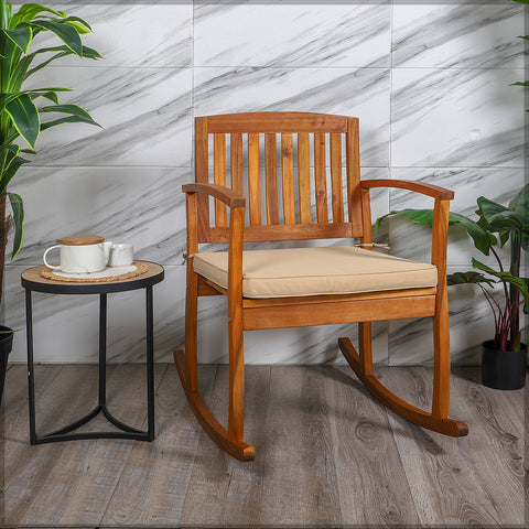 Enjoy a peaceful day in your backyard with this acacia wood Rocking Chair.