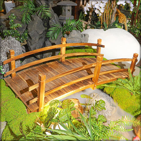 This Wooden Arch Footbridge is a charming addition to any gard